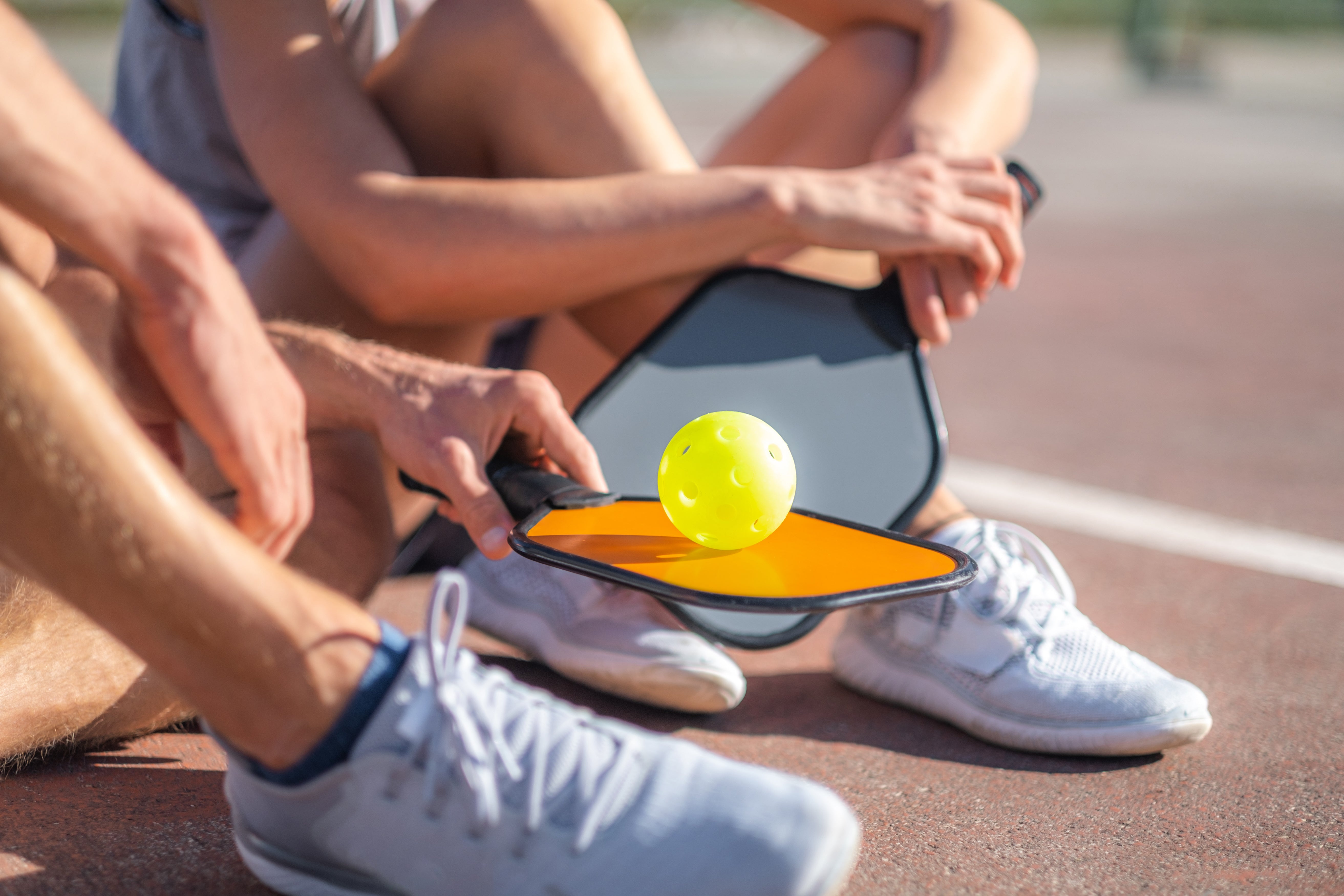 Pickleball rules guide — player on a pickleball court learning the basics