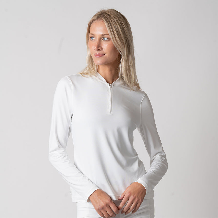 Model layering JOOLA pullover on pickleball court